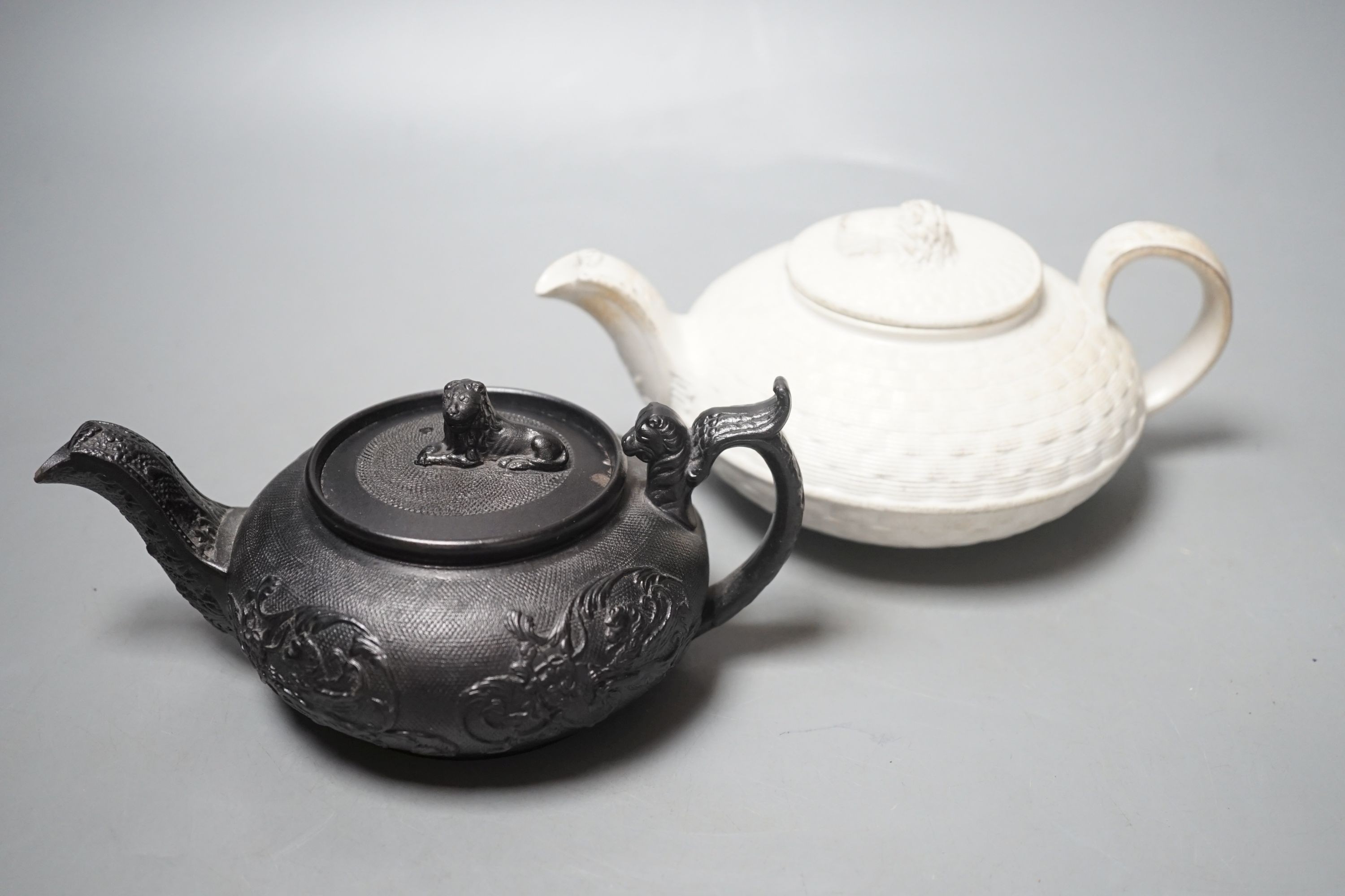 A Wedgwood caneware teapot c.1810 and an English black basalt teapot c.1810